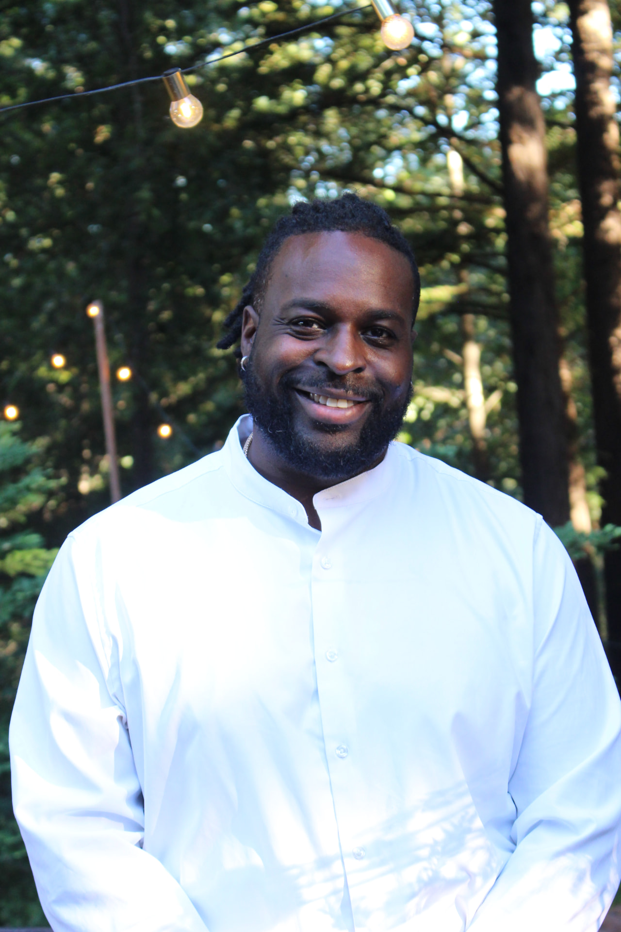 Spotlight founder Eric Hayes smiling outdoors